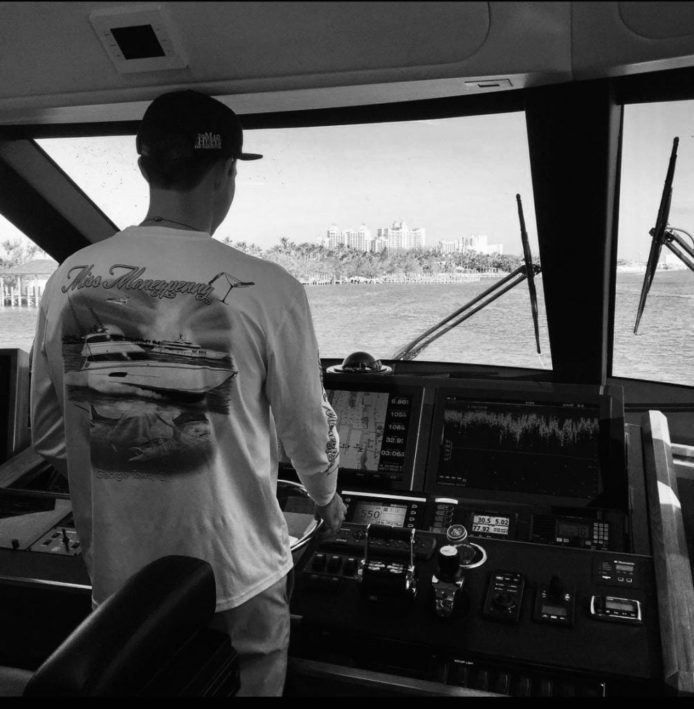 HMY Yacht Sales Professional Simon Graham at the helm of a 92 Viking Sportfish