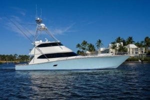 Image of 2011 Viking 82’ Enclosed Bridge “Cookie Monster” sitting in the water.