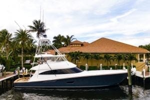 2020 Viking 80’ Convertible “Fleur De Lis” sitting in the water at a dock.