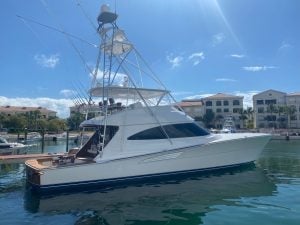 2021 Viking 72’ Convertible “Freak Show” tied up at a dock.