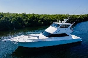 2002 Viking 61’ Enclosed Bridge “Reel Leg A Sea” sitting in the water.