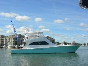 2005 Viking 61’ Convertible “Victory Lap” with a rigger full of release flags.