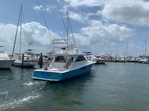 2008 Viking 52’ Sport Coupe “Tru Dat” in the water and leaving the marina.
