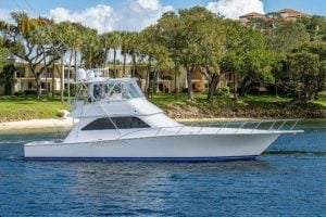 2002 Viking 52’ Convertible “Shock Wave” profile image of the boat in the water.