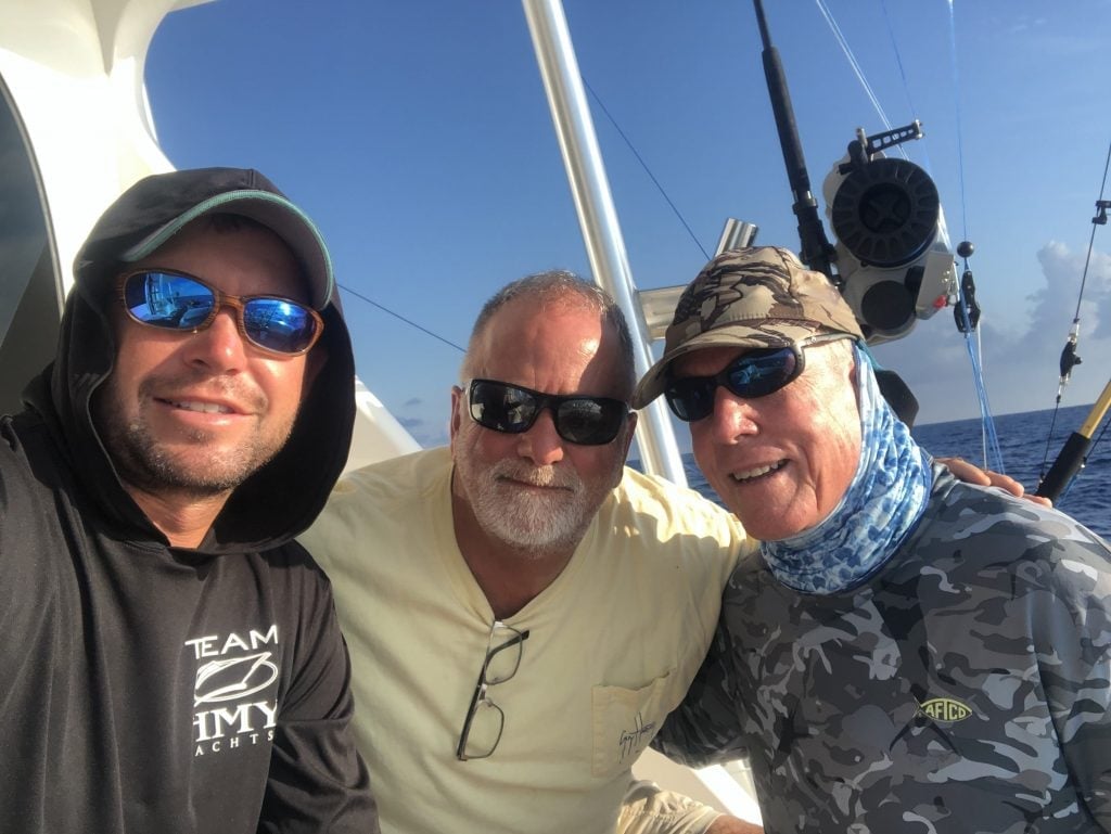 Mark Mitchell and friends on the boat, 