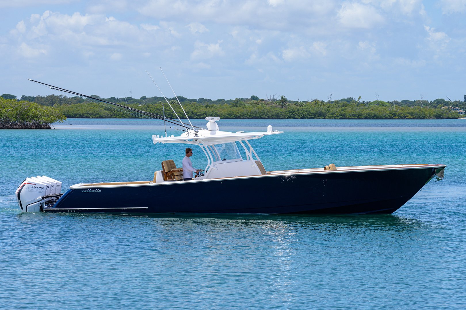 2021 Valhalla V-41 with four engines sitting in bright water. 