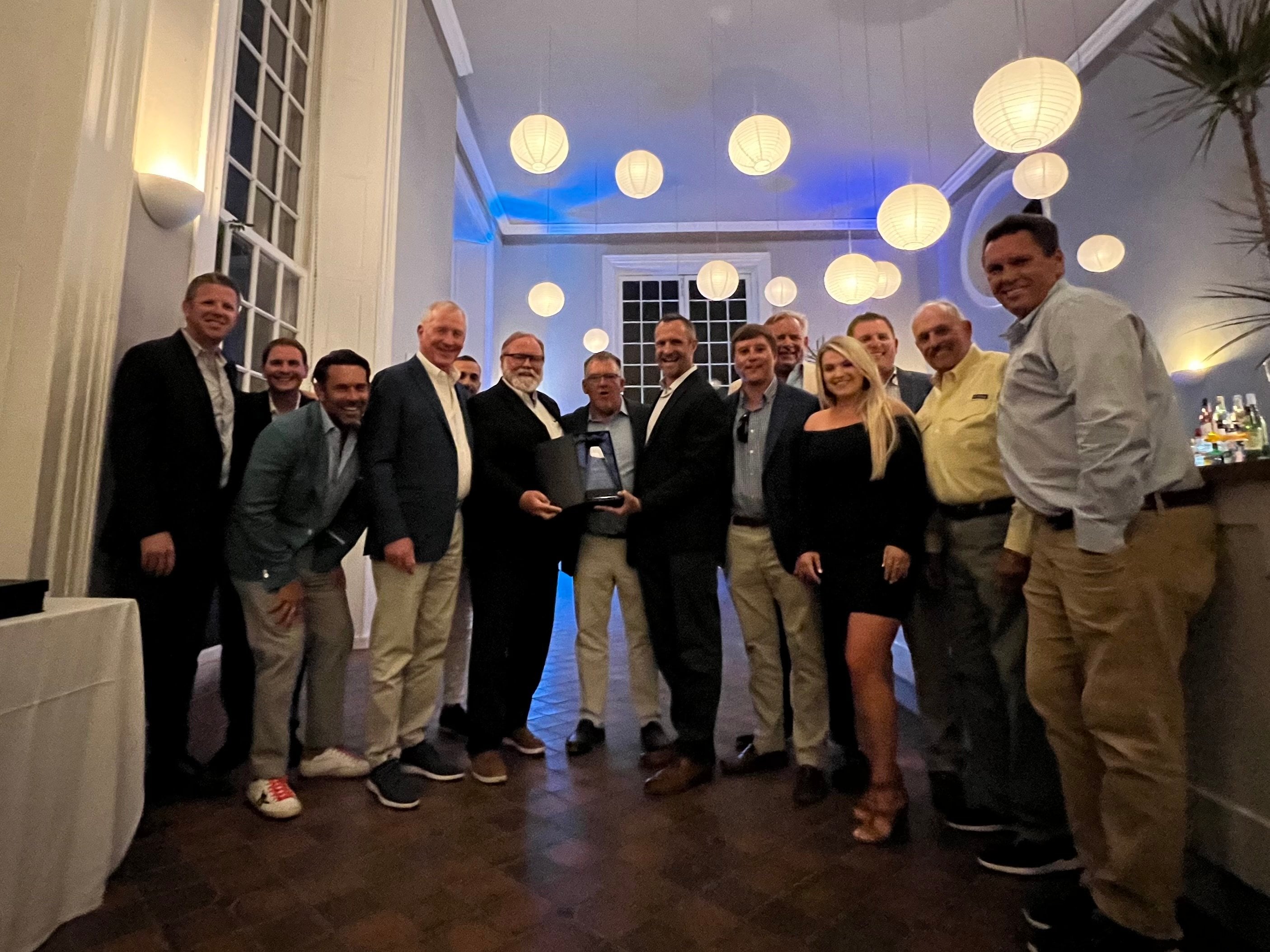 HMY Yacht Sale Princess team standing with the top princess yachts dealer award.