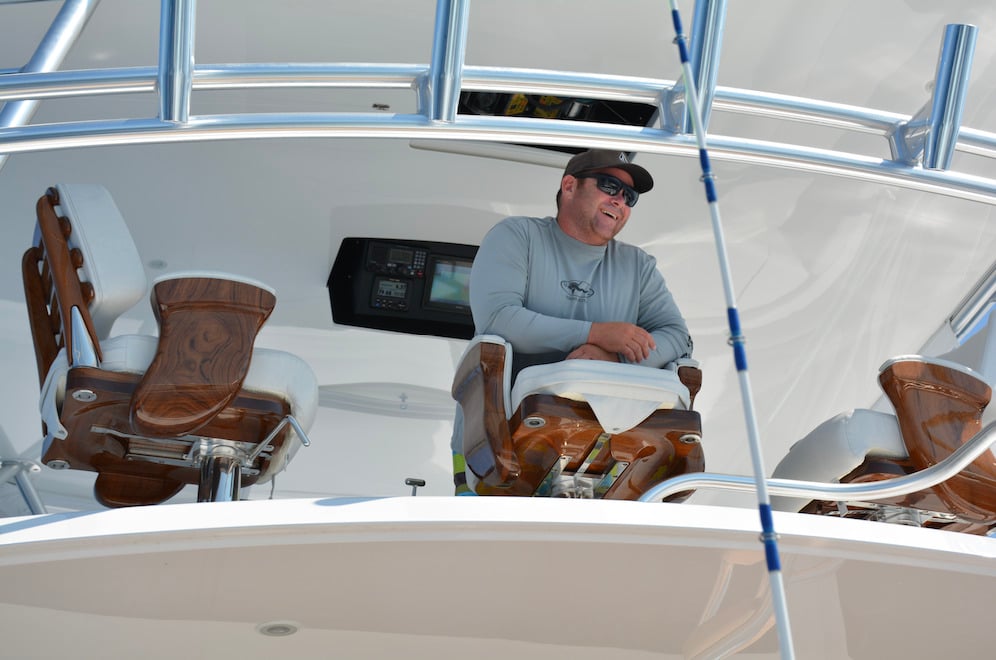 Brian-Komer-at-the-helm-of-the-Viking-Sportfsih-Demo-Boat