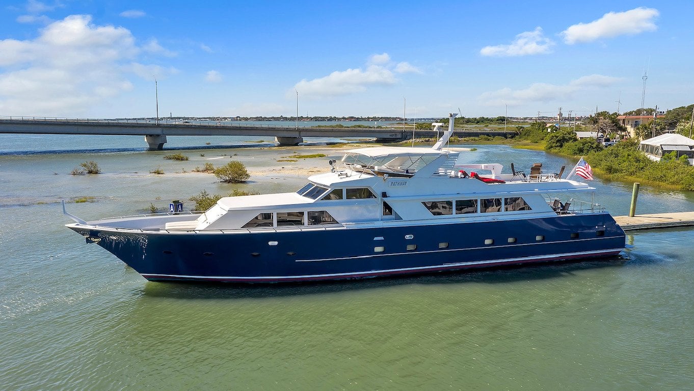 1987 Broward 104 Raised Pilothouse Yacht on the water