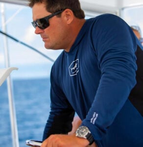 Jeff driving a boat from the flybridge