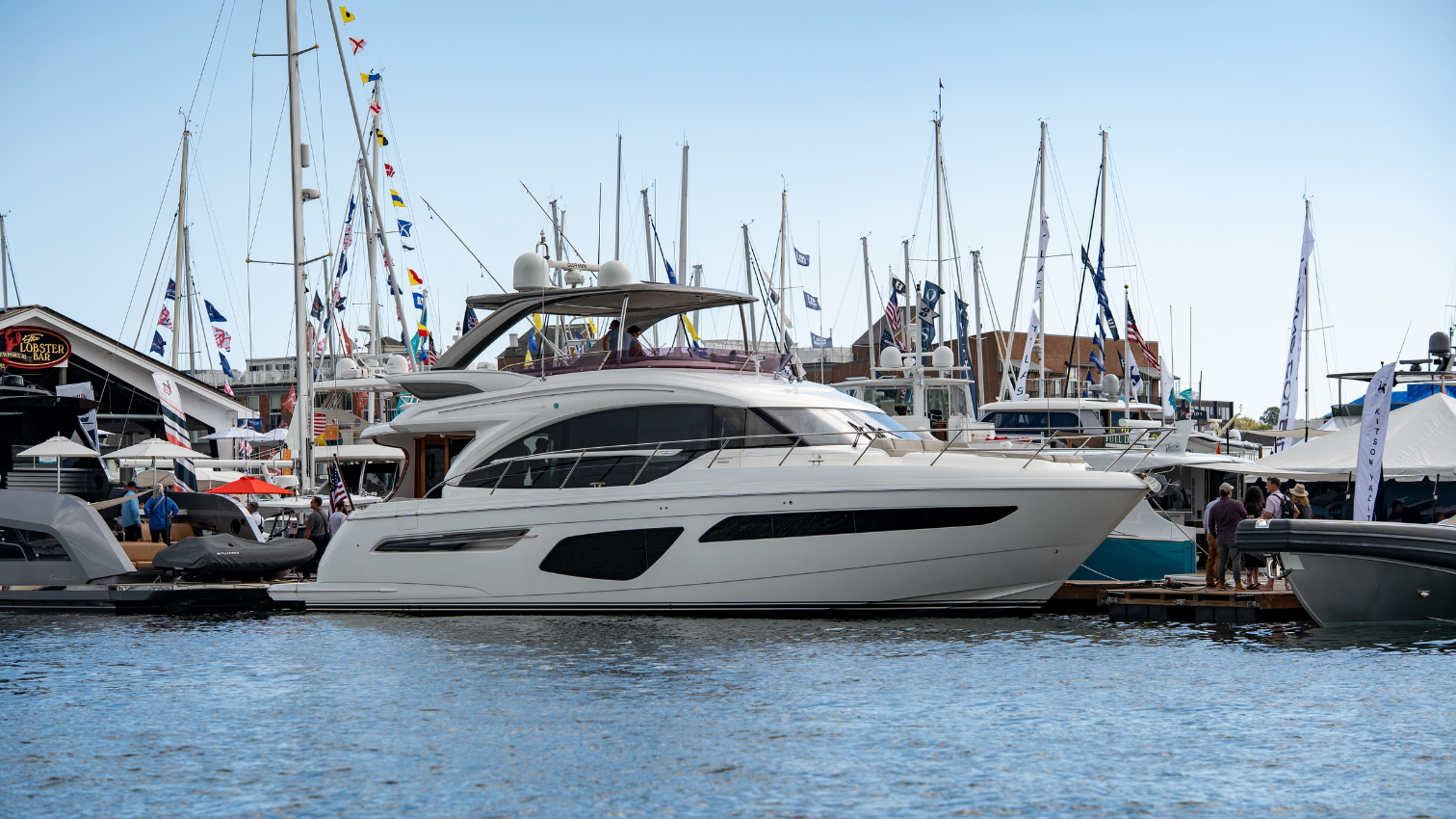 Profile image of Stumped the 2020 Princess F62 on display at the Newport Boat Show in the water.
